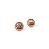 small wooden studs in rose gold color