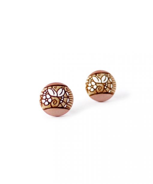 small wooden studs in rose gold color