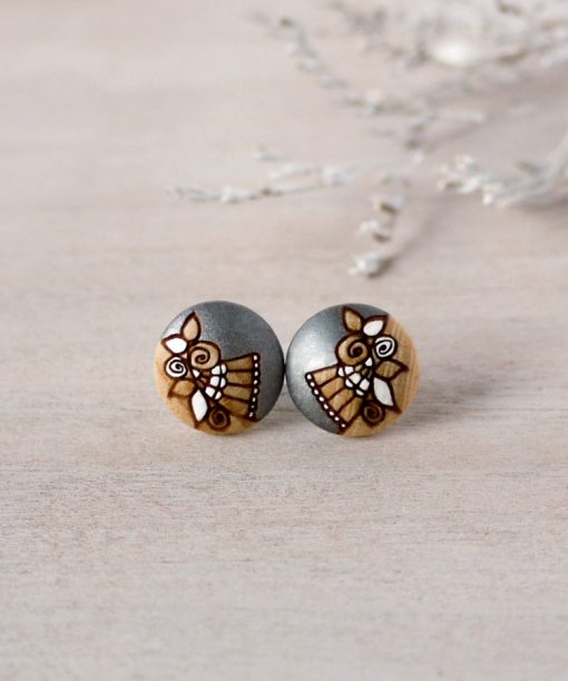small wooden studs in silver color on background