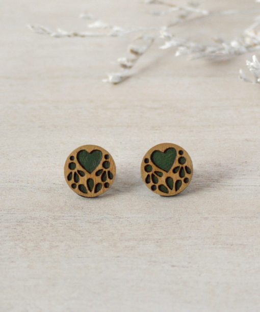 green lace wooden earrings on background
