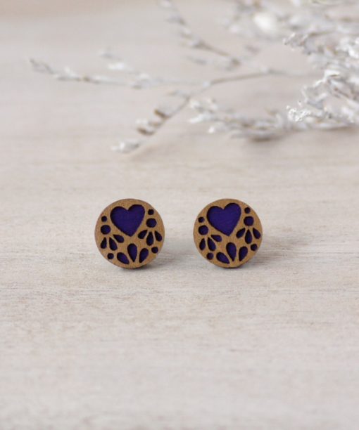 purple lace wooden earrings on background