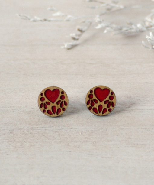 red lace wooden earrings on background