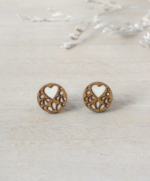 white lace wooden earrings on background