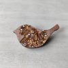 bird rose gold wooden brooch on background