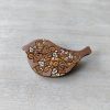 rose gold wooden brooch bird on background